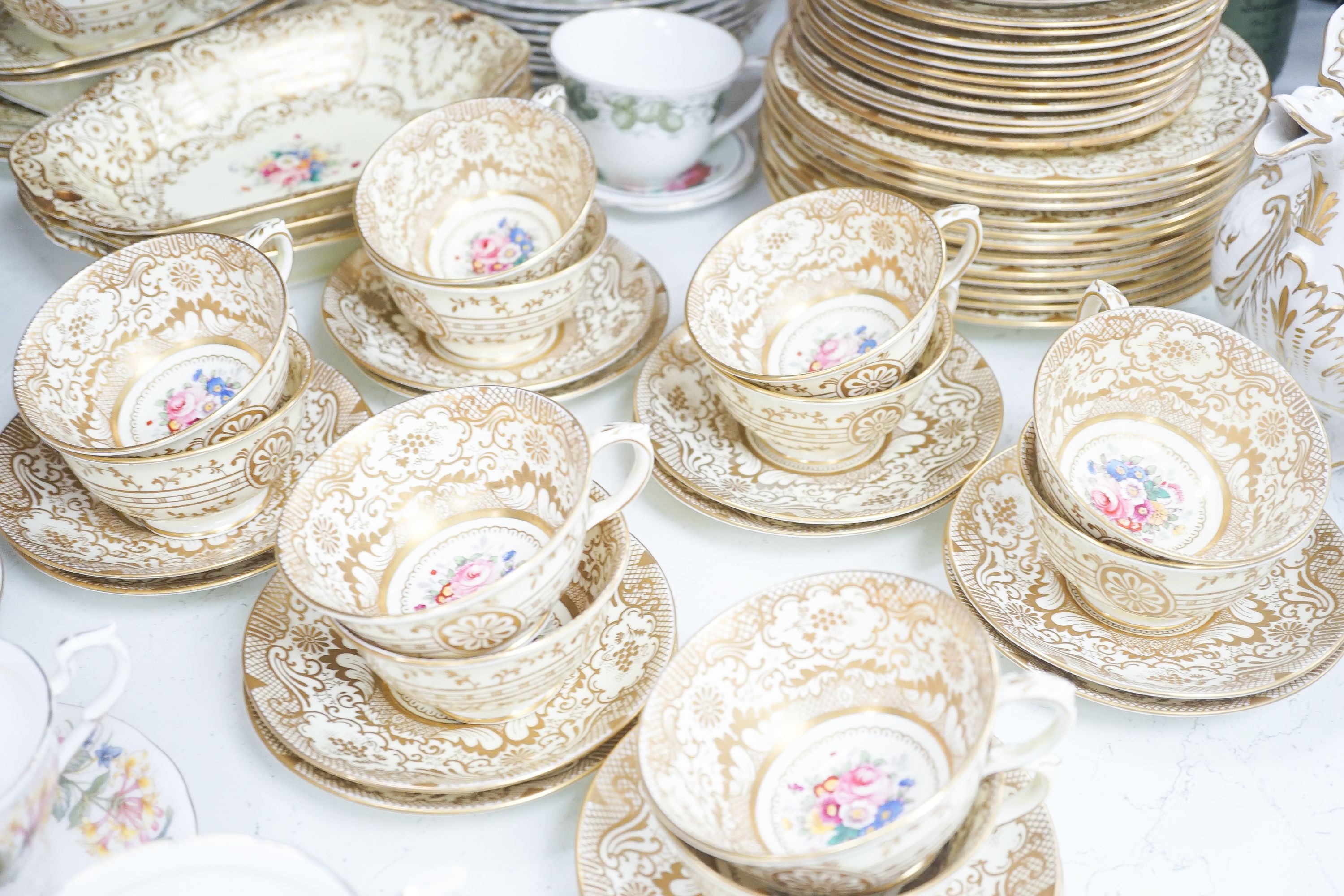 A Crown Staffordshire fifty nine piece part tea set and dessert service, central flowers and gilt borders, a Paragon part tea set and other ceramics